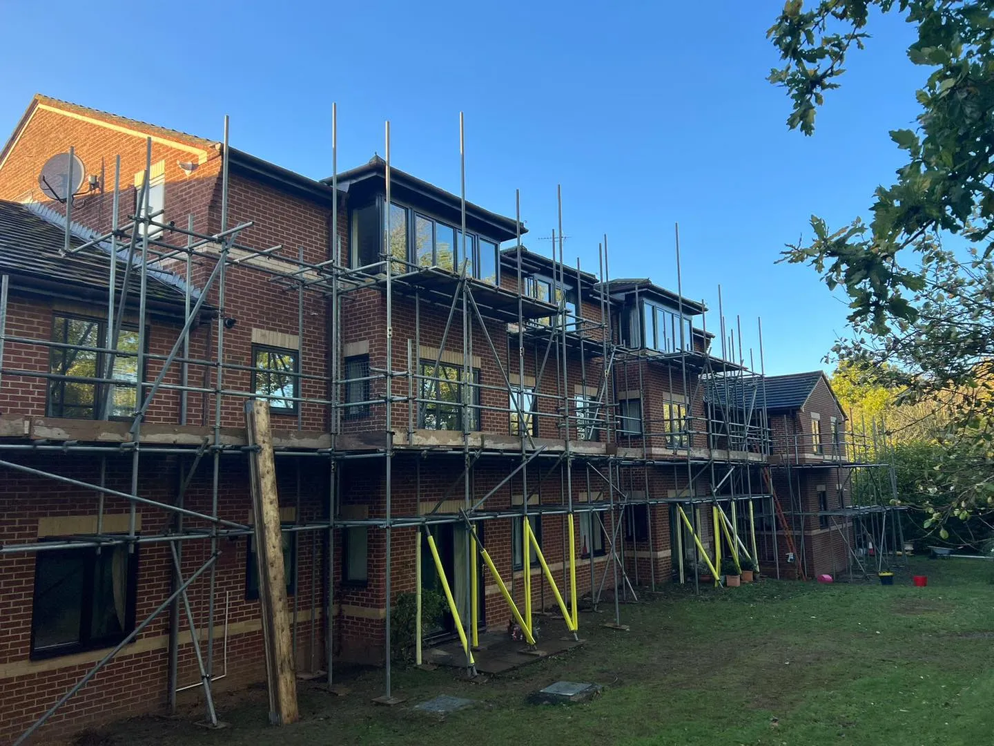 A large brick building with scaffolding around it.